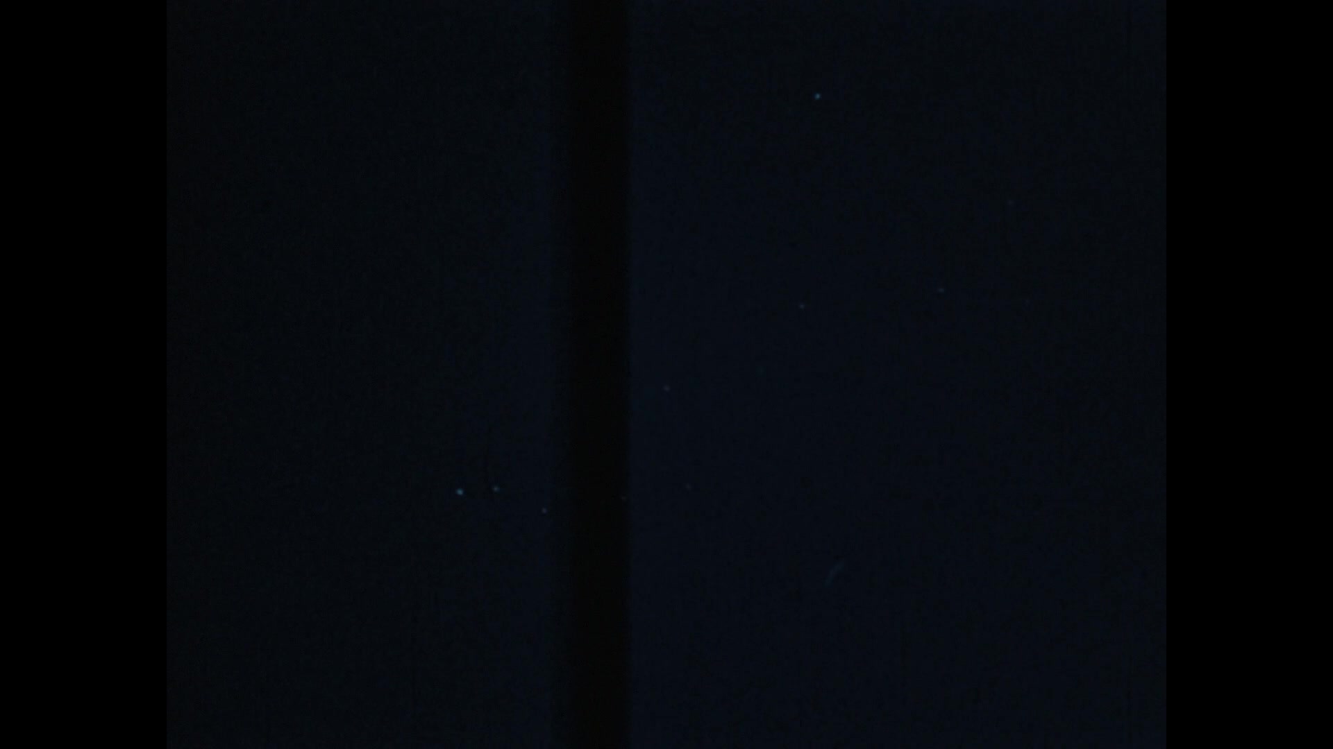 Grainy colour film frame showing bright airborne objects over Utah in footage included in the Pentagon's 2026 UAP file release.